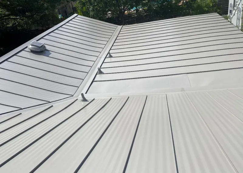 Solar attic fan installed on a metal roof for Roof Ventilation in South Miami Heights